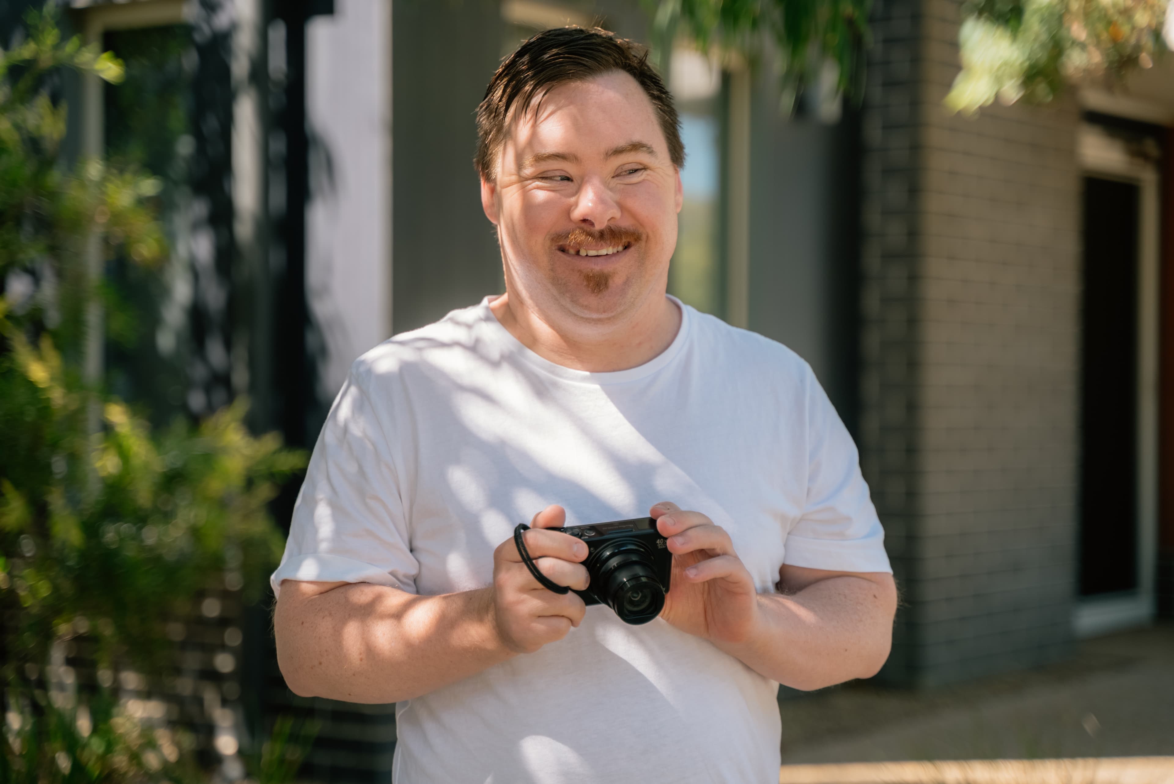 genU client, David holding his camera