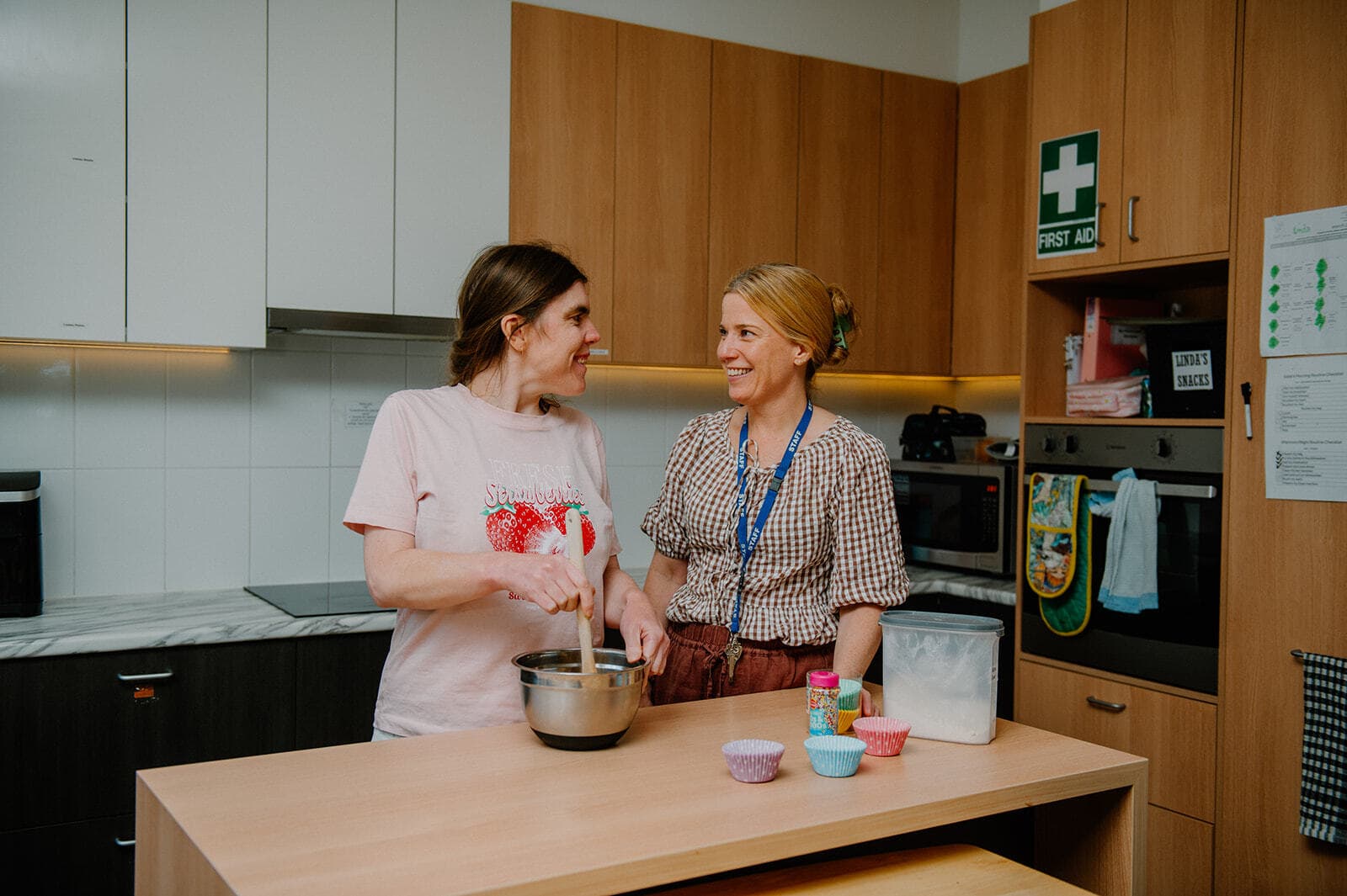 Linda and Leah standing in Linda's kitchen