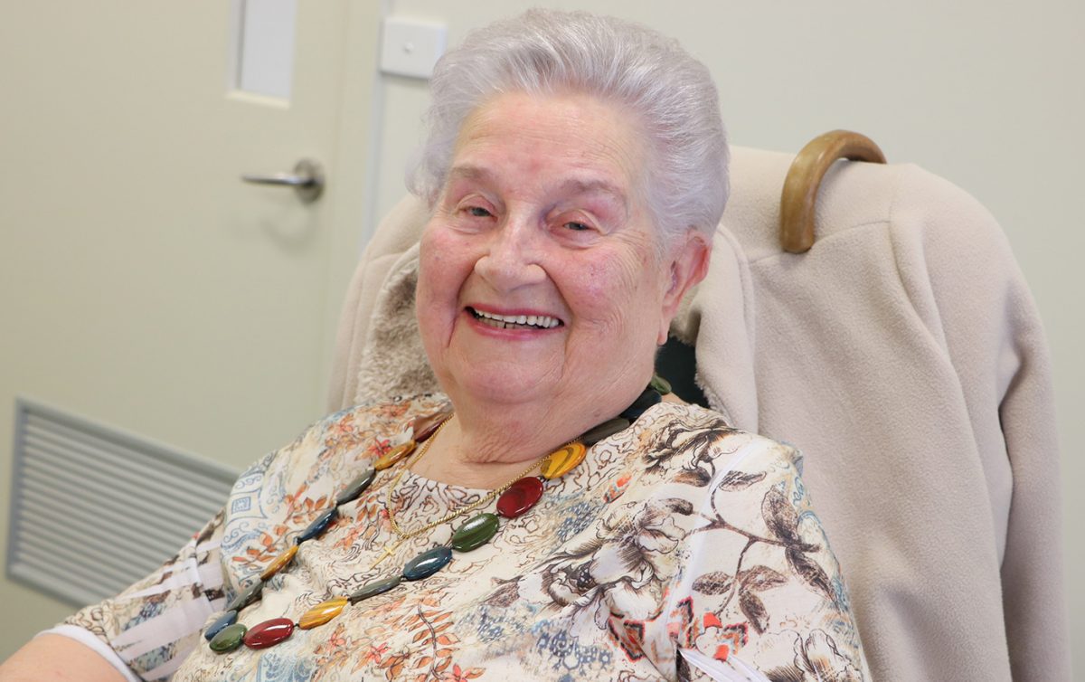 Ages care woman seated smiling