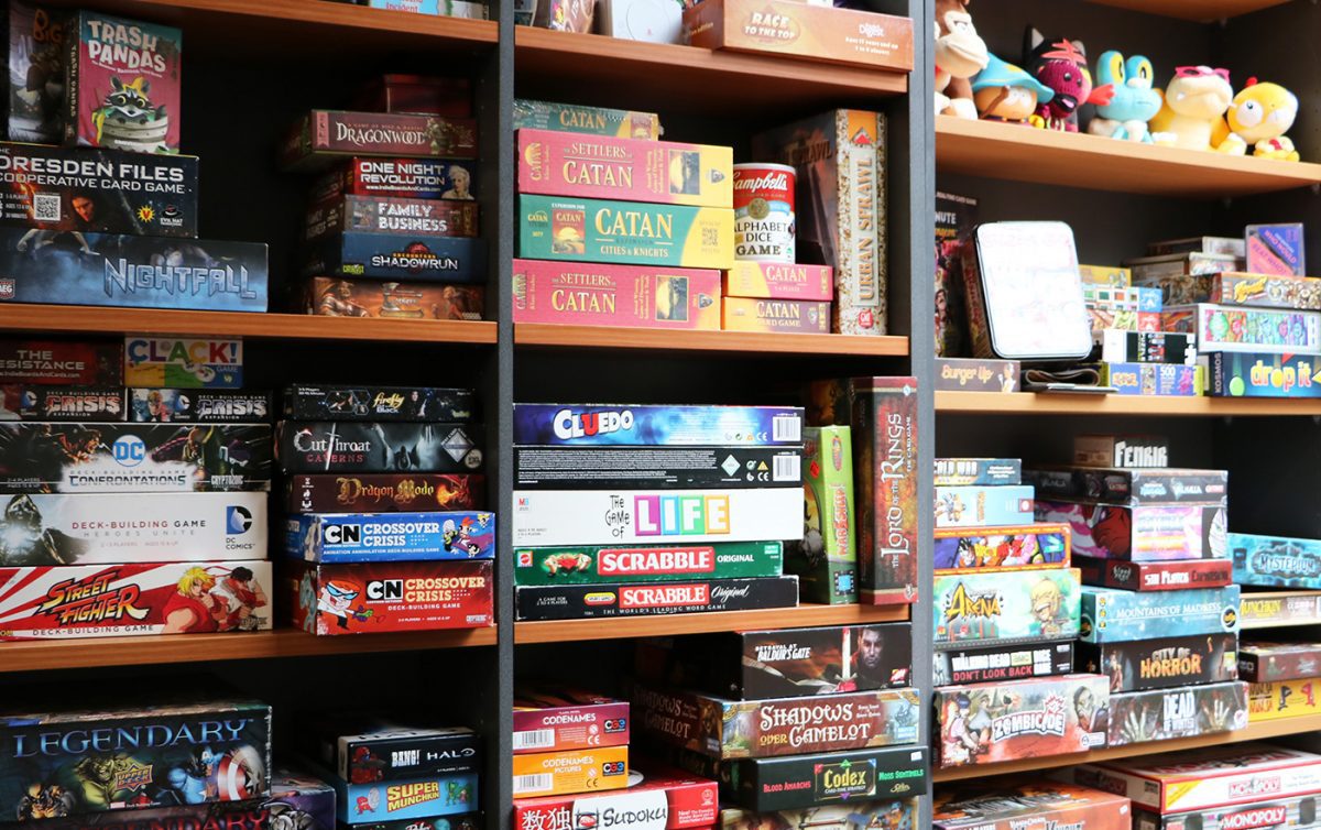 Board games sitting on shelf at Gen U Gamer