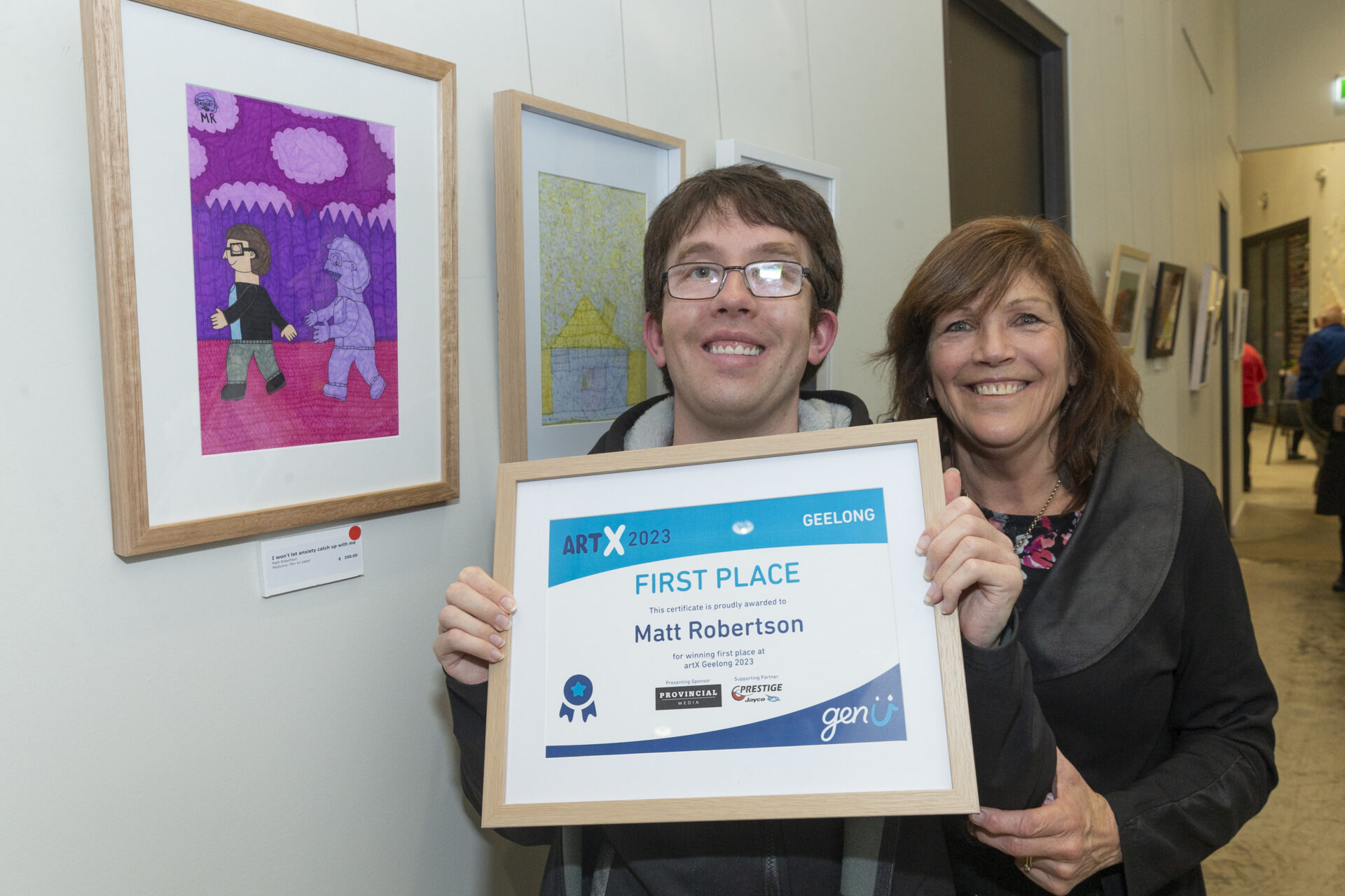 ArtX’s 2023 First Place Recipient, Matt Robertson holding up certificate alongside his award-winning Art (left), and Mother (right).