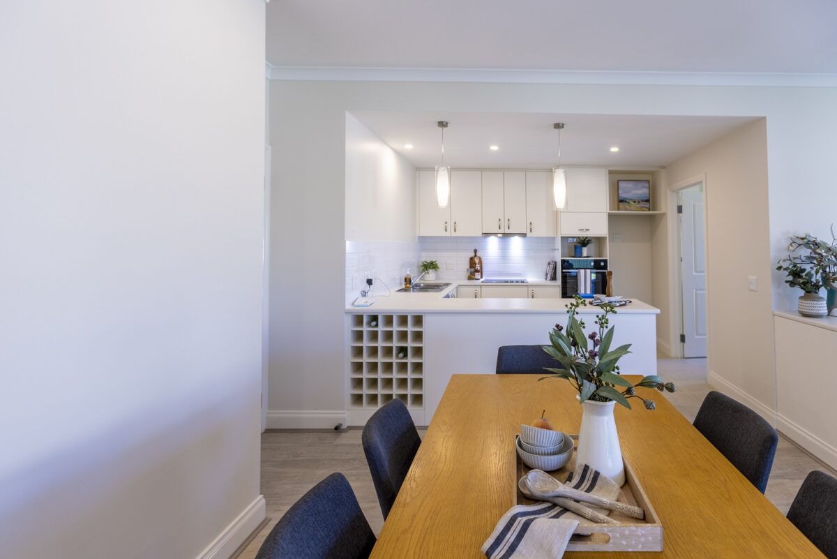 The dining room and kitchen in The Highton at Barwarre Gardens Retirement Community